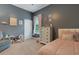 Lovely bedroom with large windows, a dresser, and charming decor at 1470 Silver Leaf Dr, Lakeland, FL 33813
