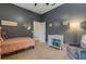 Comfortable bedroom featuring dark walls, a bookshelf, and cozy armchair at 1470 Silver Leaf Dr, Lakeland, FL 33813