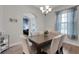 Inviting dining room with chandelier, hardwood floors, and comfortable seating at 1470 Silver Leaf Dr, Lakeland, FL 33813