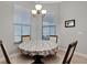 Quaint dining room with table and chairs and a chandelier at 1470 Silver Leaf Dr, Lakeland, FL 33813