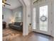 Bright foyer with hardwood floors, leading into a comfortable living room at 1470 Silver Leaf Dr, Lakeland, FL 33813