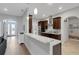 Open concept kitchen has stainless steel appliances, beautiful counter tops and hardwood flooring at 1470 Silver Leaf Dr, Lakeland, FL 33813