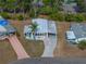 An aerial view of the home, driveway, and landscaping at 1642 Tally Ho Dr, Lakeland, FL 33810