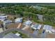 An aerial view of the property, street, nearby lake, and local area at 1642 Tally Ho Dr, Lakeland, FL 33810