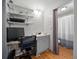 Bathroom with open shelves, vanity, and shower behind the curtain at 1642 Tally Ho Dr, Lakeland, FL 33810