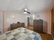 Bedroom featuring wood floors, ceiling fan, and neutral wall color at 1642 Tally Ho Dr, Lakeland, FL 33810