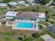 Community pool with ample seating, set amidst lush landscaping for relaxation and recreation at 1642 Tally Ho Dr, Lakeland, FL 33810