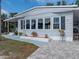 This home features multiple windows for natural light and a beautifully landscaped yard at 1642 Tally Ho Dr, Lakeland, FL 33810