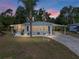 Charming single-story home with a covered front patio and paved driveway at 1642 Tally Ho Dr, Lakeland, FL 33810