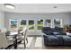 Open concept living room with dining area and natural light from the many windows at 1642 Tally Ho Dr, Lakeland, FL 33810