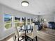 Open concept living room with dining area and natural light from the many windows at 1642 Tally Ho Dr, Lakeland, FL 33810