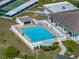 Aerial view of a beautiful community pool with ample lounge chairs and seating areas at 1642 Tally Ho Dr, Lakeland, FL 33810
