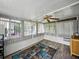 Inviting sunroom featuring lots of windows and natural light with vinyl flooring at 1642 Tally Ho Dr, Lakeland, FL 33810