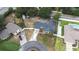 Aerial view of home with long drive way, utility trailer, shed, and well manicured landscaping at 1808 Stonecrest Ct, Lakeland, FL 33813