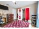 Bedroom featuring bright lighting, a closet, and a door to the backyard at 1808 Stonecrest Ct, Lakeland, FL 33813
