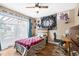 Bedroom with a ceiling fan, a window for light, and a desk for working from home at 1808 Stonecrest Ct, Lakeland, FL 33813