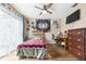 Bedroom with a ceiling fan, a window for light, and a desk for working from home at 1808 Stonecrest Ct, Lakeland, FL 33813