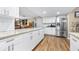 Spacious, open concept kitchen with stainless steel appliances, granite countertop island at 1808 Stonecrest Ct, Lakeland, FL 33813