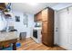Well-equipped laundry room featuring cabinets, a washing machine, and dryer at 1808 Stonecrest Ct, Lakeland, FL 33813