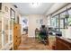 Well-lit office space with wood flooring, ample natural light, and closet access at 1808 Stonecrest Ct, Lakeland, FL 33813