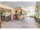 Enclosed patio with ample natural light, bar seating, and lush tropical plants at 1808 Stonecrest Ct, Lakeland, FL 33813