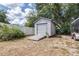 Backyard features a storage shed with a roll-up door and ramp for easy access at 1808 Stonecrest Ct, Lakeland, FL 33813