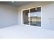 Spacious outdoor patio area with sliding glass doors leading inside at 1809 Noble Dr, Davenport, FL 33837