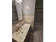 Bathroom featuring a large vanity with sink, white tile and a walk-in shower at 1809 Optimist Dr, Lakeland, FL 33801