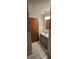 Bathroom featuring a large vanity with sink and a white tiled floor at 1809 Optimist Dr, Lakeland, FL 33801