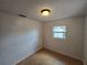 Bedroom featuring light hardwood floors, single window and white walls at 1809 Optimist Dr, Lakeland, FL 33801
