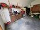 Functional garage space with workbench, shelving, and ample storage for tools and projects at 1809 Optimist Dr, Lakeland, FL 33801