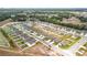 An aerial view of a residential neighborhood featuring new homes with spacious yards and well-maintained streets at 1821 Thompson Preserve Boulevard, Bartow, FL 33830
