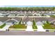 An aerial view of a residential neighborhood with well-kept lawns and white fences at 1821 Thompson Preserve Boulevard, Bartow, FL 33830
