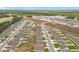 Aerial view of new construction homes with white fences, offering privacy and curb appeal in a suburban setting at 1821 Thompson Preserve Boulevard, Bartow, FL 33830