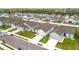 New homes in a residential neighborhood with well-manicured lawns and white fences at 1821 Thompson Preserve Boulevard, Bartow, FL 33830