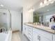 Spacious bathroom featuring a soaking tub, glass-enclosed shower, and double vanity at 1821 Thompson Preserve Boulevard, Bartow, FL 33830