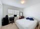 Well-lit bedroom featuring carpet, neutral walls, desk, and window offering natural light at 1821 Thompson Preserve Boulevard, Bartow, FL 33830
