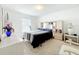 Bright bedroom features neutral decor and natural light from a window at 1821 Thompson Preserve Boulevard, Bartow, FL 33830
