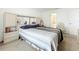 A neutral bedroom is well lit with a connected bathroom at 1821 Thompson Preserve Boulevard, Bartow, FL 33830