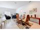 Open-concept dining room connected to the living room with lots of natural light at 1821 Thompson Preserve Boulevard, Bartow, FL 33830