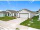 Beautiful single-story home showcases a manicured lawn and a convenient two-car garage at 1821 Thompson Preserve Boulevard, Bartow, FL 33830
