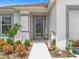 Welcoming front porch with decorative plants and a welcoming entrance at 1821 Thompson Preserve Boulevard, Bartow, FL 33830