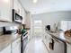 Well-lit kitchen with stainless steel appliances and ample counter space at 1821 Thompson Preserve Boulevard, Bartow, FL 33830