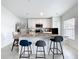 Modern kitchen features a center island with seating and stainless steel appliances at 1821 Thompson Preserve Boulevard, Bartow, FL 33830