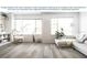Bright living room with modern vinyl plank flooring, large windows, and stylish furnishings at 1833 Noble Dr, Davenport, FL 33837