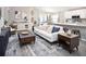 Open-concept living room showcasing stylish furniture, a contemporary rug, and an inviting atmosphere at 1837 Noble Dr, Davenport, FL 33837