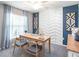 Well-lit home office featuring a stylish desk, comfortable chairs, and modern wall decor at 1837 Noble Dr, Davenport, FL 33837