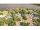 Breathtaking aerial view of the property showcasing the expansive estate, lake access, and mature trees at 2070 W Lake Hamilton Dr, Winter Haven, FL 33881