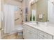 Bathroom featuring a white vanity, tub, and shower at 2070 W Lake Hamilton Dr, Winter Haven, FL 33881