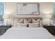 Bedroom with comfortable bed and decorative lamps at 2070 W Lake Hamilton Dr, Winter Haven, FL 33881